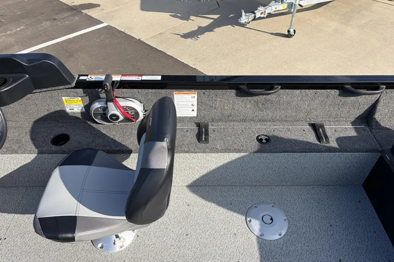 Slide: The Image of 2026 Crestliner 1850 Kodiak SC boat interior with seating and control panel. - 10