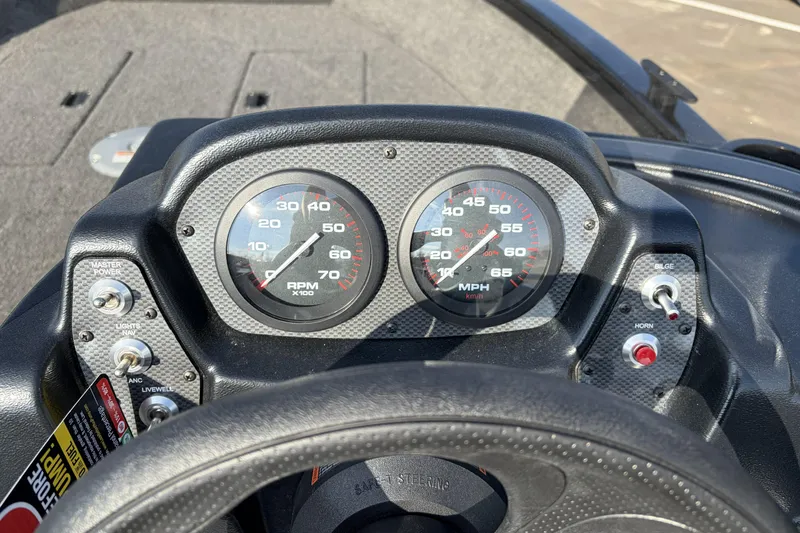 Slide: The Image of Dashboard of 2026 Crestliner 1850 Kodiak SC boat with speedometer and controls. - 13