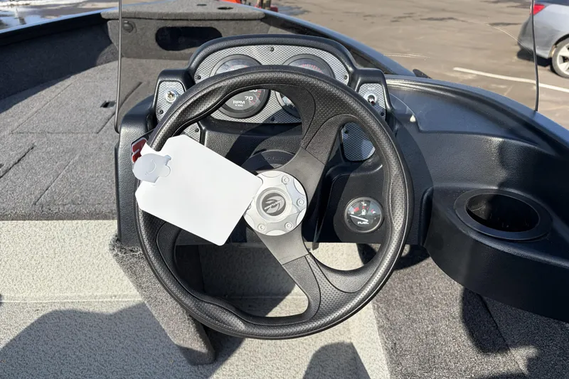 Slide: The Image of 2026 Crestliner 1850 Kodiak SC boat dashboard with steering wheel and gauges. - 14