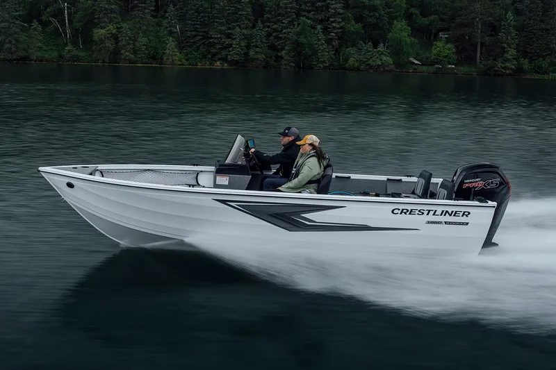 Slide: The Image of Manufacturer Provided Image: 2026 Crestliner 1850 Kodiak SC boat cruising on a serene lake with lush forest backdrop. - 24
