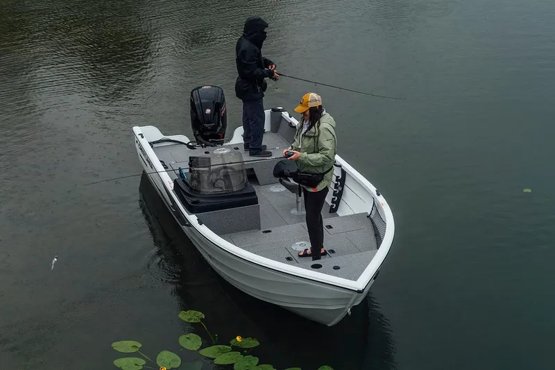 Slide: The Image of Manufacturer Provided Image: 2026 Crestliner 1850 Kodiak SC fishing boat with two anglers on a calm lake. - 25