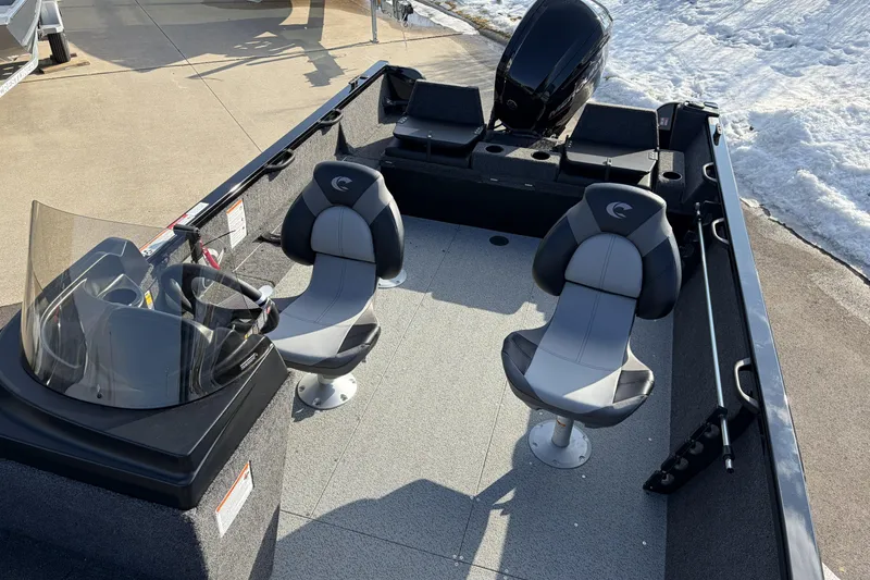 Slide: The Image of 2026 Crestliner 1850 Kodiak SC boat interior with two seats and steering console. - 4