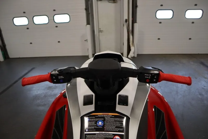 Slide: The Image of 2025 Yamaha WaveRunner GP HO with red handlebars in a garage setting. - 11
