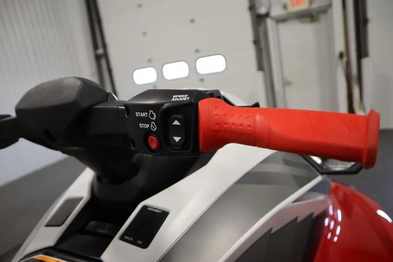Slide: The Image of 2025 Yamaha WaveRunner GP HO handlebar with red grip and control buttons. - 13