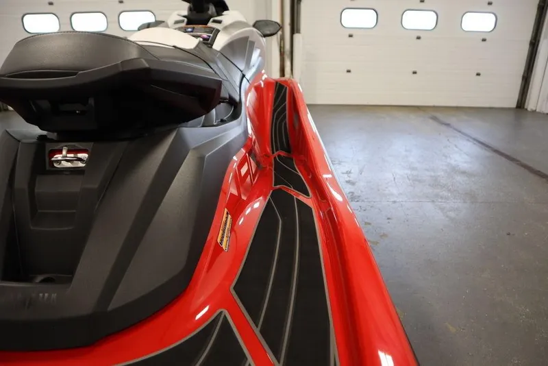 Slide: The Image of 2025 Yamaha WaveRunner GP HO in a garage, showcasing sleek red design. - 16