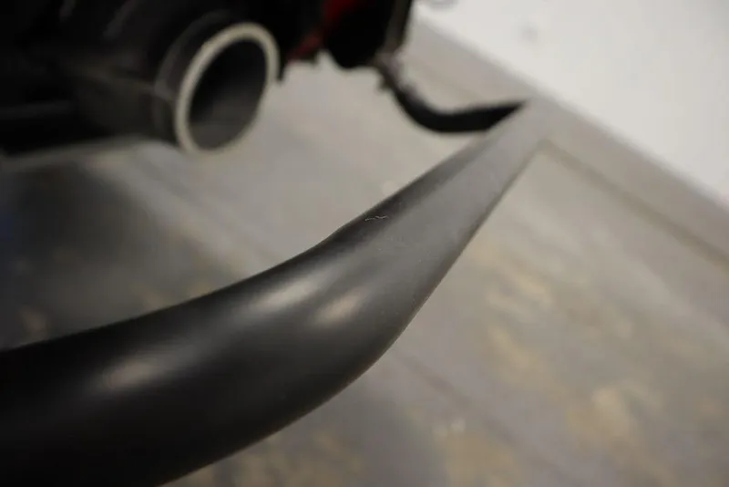 Slide: The Image of Close-up of 2025 Yamaha WaveRunner GP HO exhaust pipe in a garage setting. - 21