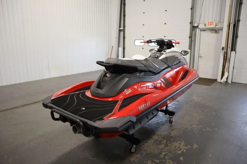 Slide: The Image of 2025 Yamaha WaveRunner GP HO in a garage, showcasing sleek red and black design. - 6