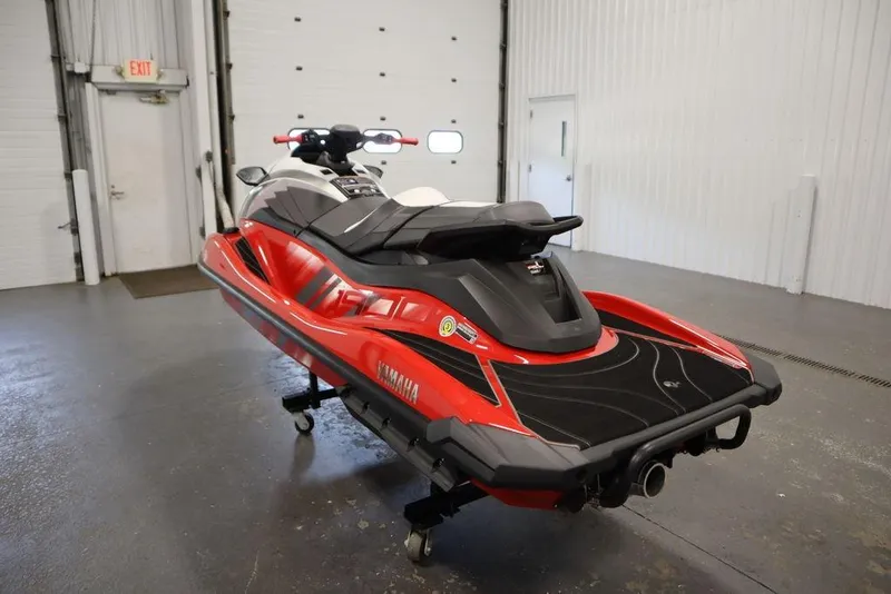 Slide: The Image of 2025 Yamaha WaveRunner GP HO in a garage, showcasing sleek red and black design. - 7