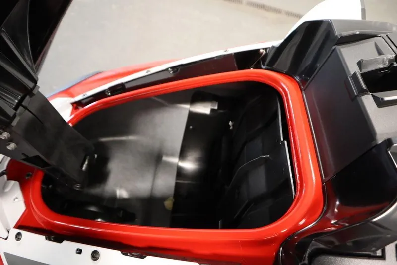 Slide: The Image of 2025 Yamaha WaveRunner GP HO storage compartment with red trim, open view. - 8