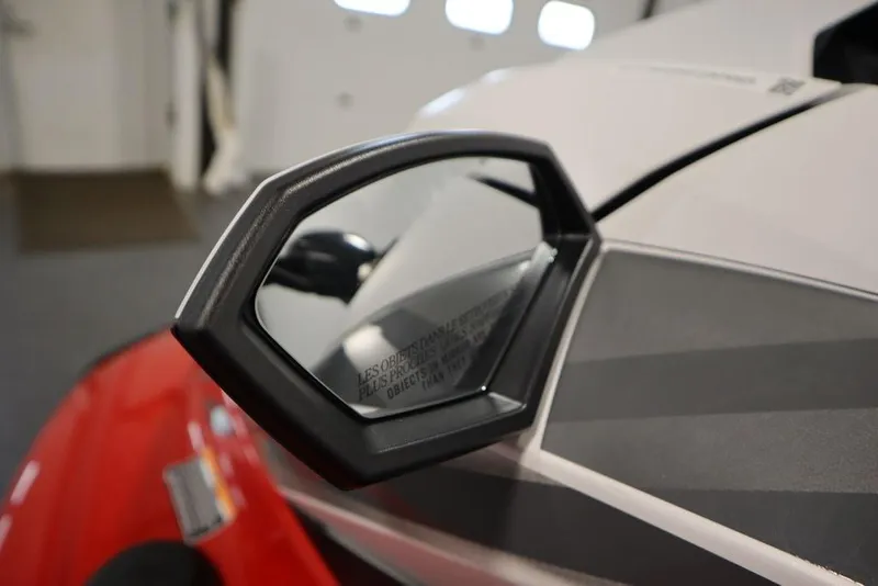 Slide: The Image of 2025 Yamaha WaveRunner GP HO side mirror close-up in a showroom setting. - 9