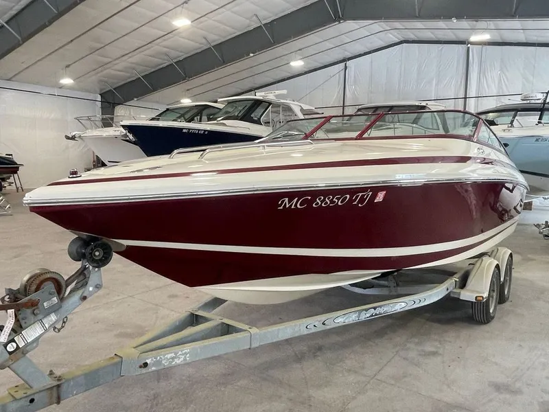 The Image of 2001 Cobalt 227 boat in storage facility on trailer. - 0