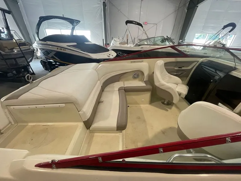 Slide: The Image of Interior of a 2001 Cobalt 227 boat with white seating. - 10