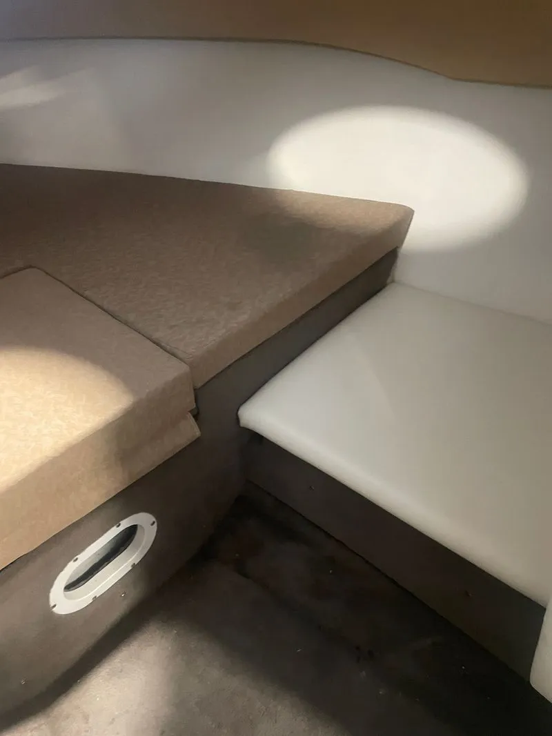 Slide: The Image of Interior of a 2001 Cobalt 227 boat with seating area. - 19