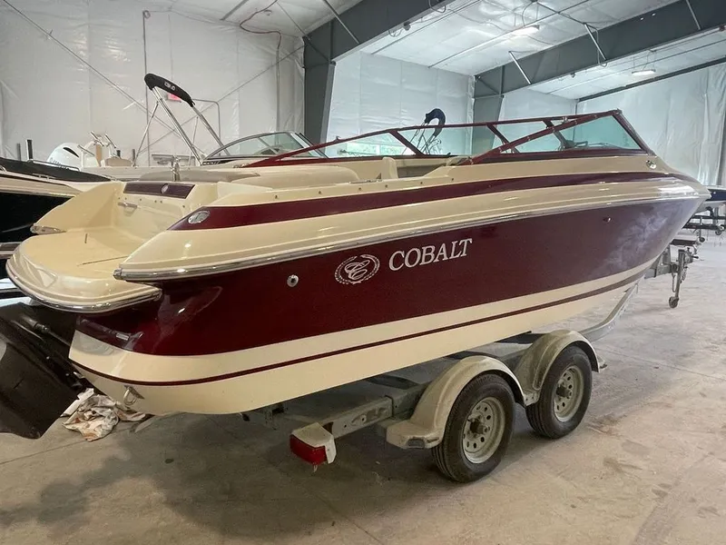 Slide: The Image of 2001 Cobalt 227 boat in a storage facility on a trailer. - 3