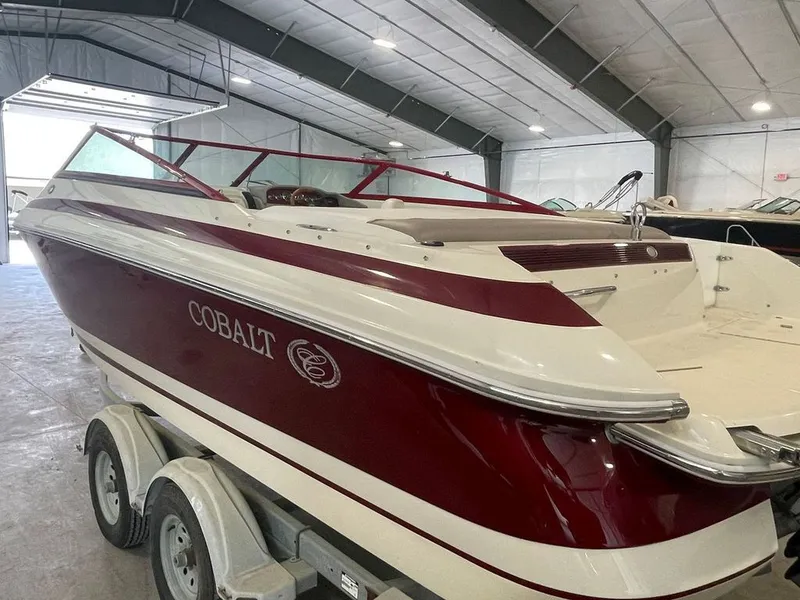 Slide: The Image of 2001 Cobalt 227 boat in a storage facility on a trailer. - 4