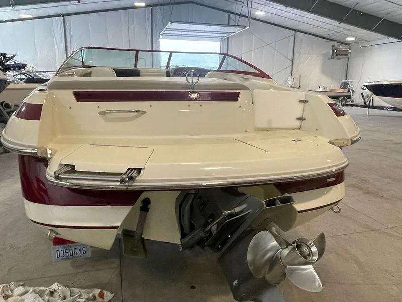 Slide: The Image of Rear view of a 2001 Cobalt 227 boat in a storage facility. - 7