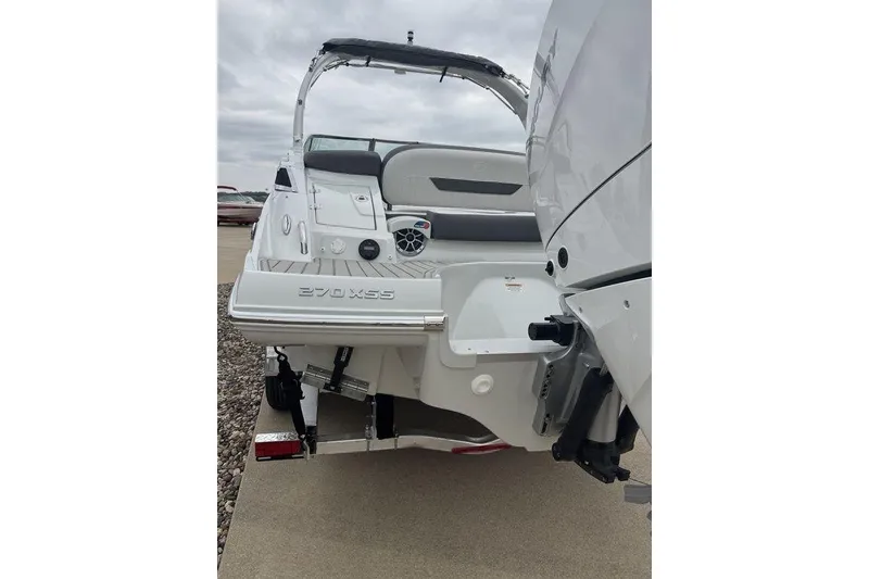 Slide: The Image of 2025 Crownline 270 XSS boat rear view with swim platform and seating. - 3