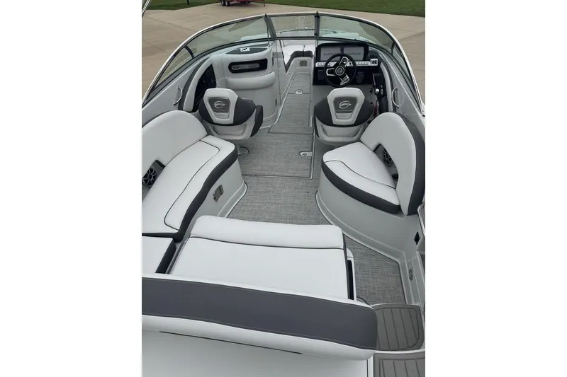 Slide: The Image of 2025 Crownline 270 XSS boat interior with sleek seating and modern dashboard design. - 5