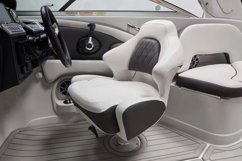 Slide: The Image of 2025 Crownline 270 XSS boat interior with modern helm and seating design. - 7