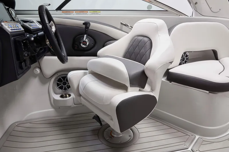 Slide: The Image of 2025 Crownline 270 XSS boat interior with modern helm and luxurious seating. - 8