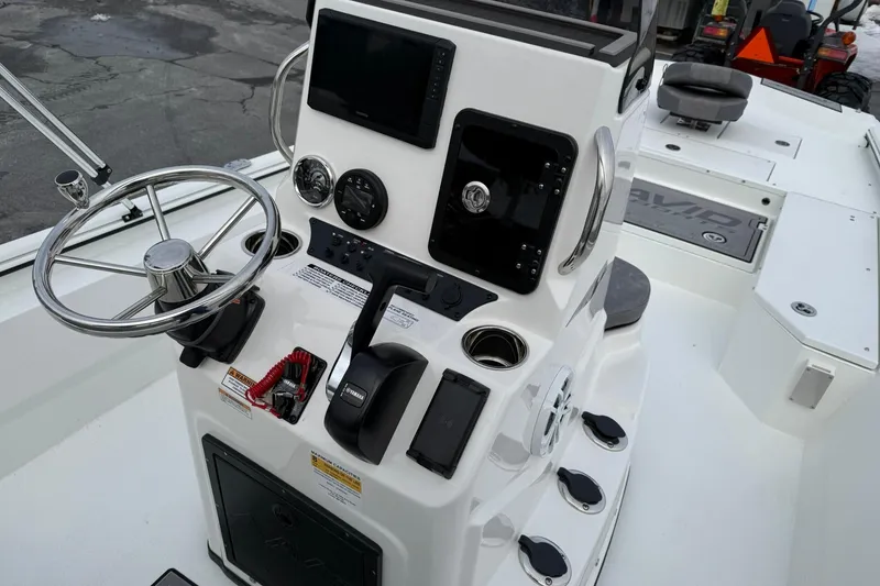 Slide: The Image of Avid 22 Recon 2026 boat console with steering wheel and controls. - 11