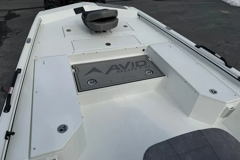 Slide: The Image of Avid 22 Recon 2026 boat interior with seating and storage compartments. - 17
