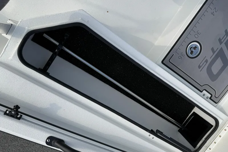 Slide: The Image of Storage compartment of 2026 Avid 22 Recon boat with measuring scale. - 20