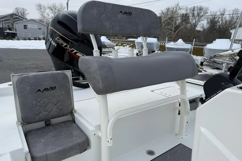 Slide: The Image of Avid 22 Recon 2026 boat interior with Yamaha engine, featuring gray seating. - 8