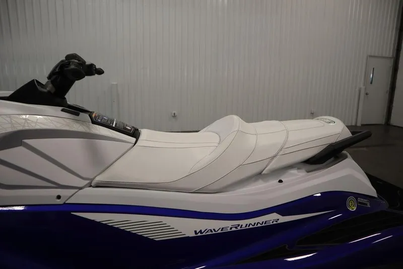 Slide: The Image of 2024 Yamaha WaveRunner GP SVHO with sleek white and blue design in a showroom. - 16