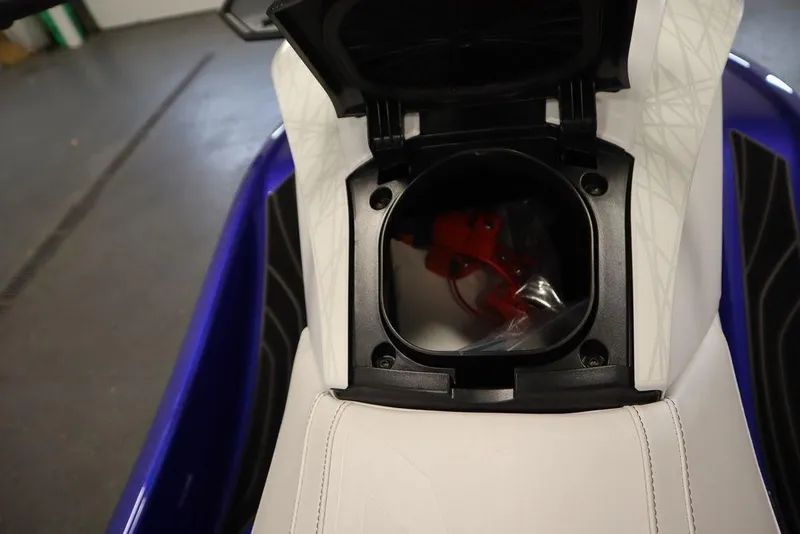 Slide: The Image of 2024 Yamaha WaveRunner GP SVHO storage compartment with open lid, showcasing interior details. - 17
