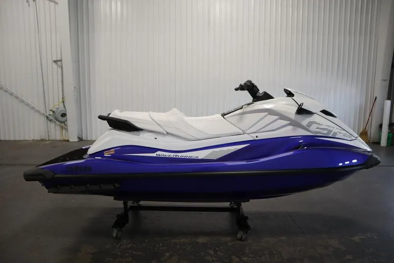 Slide: The Image of 2024 Yamaha WaveRunner GP SVHO in a showroom, featuring sleek white and blue design. - 3