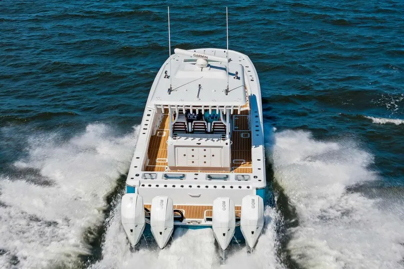 Slide: The Image of Barker Boatworks 40 HPC 2022 cruising on open water with powerful engines. - 5