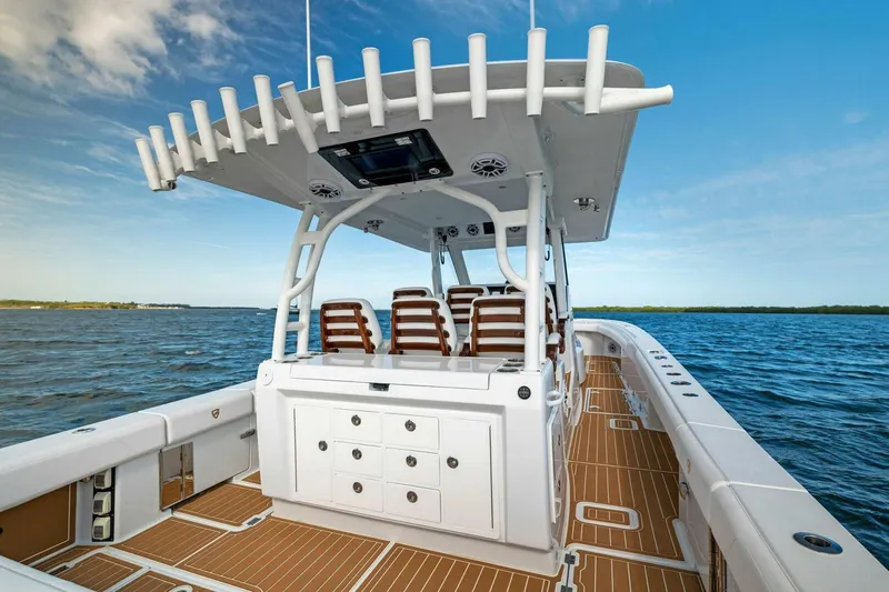 Slide: The Image of 2022 Barker Boatworks 40 HPC on water, featuring spacious deck and modern design. - 6
