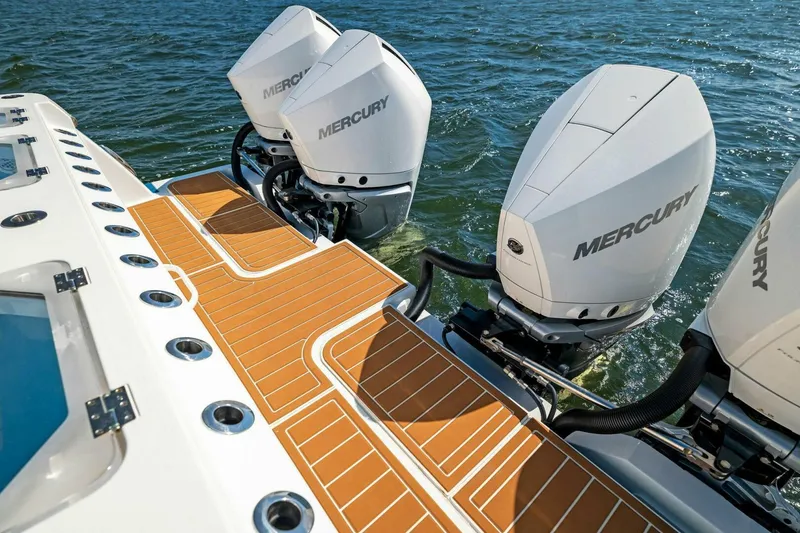Slide: The Image of 2022 Barker Boatworks 40 HPC with Mercury outboard engines on water. - 16