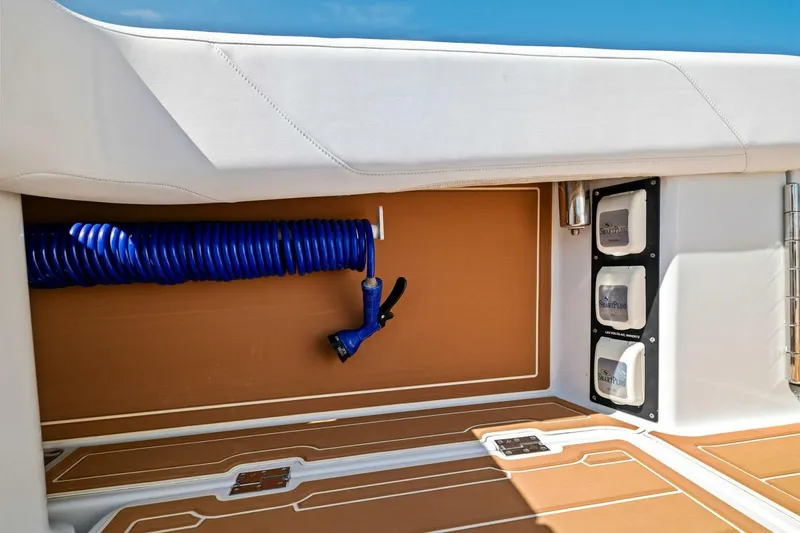 Slide: The Image of 2022 Barker Boatworks 40 HPC deck with coiled blue hose and SmartPlug outlets. - 22