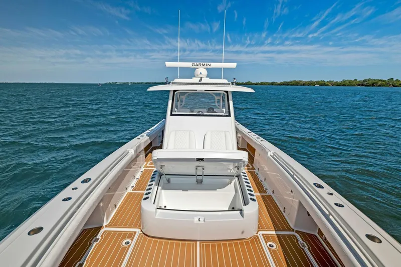 Slide: The Image of 2022 Barker Boatworks 40 HPC on water, featuring open deck and Garmin equipment. - 24