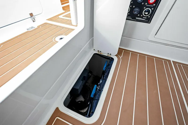 Slide: The Image of 2022 Barker Boatworks 40 HPC interior with open hatch and control panel. - 28