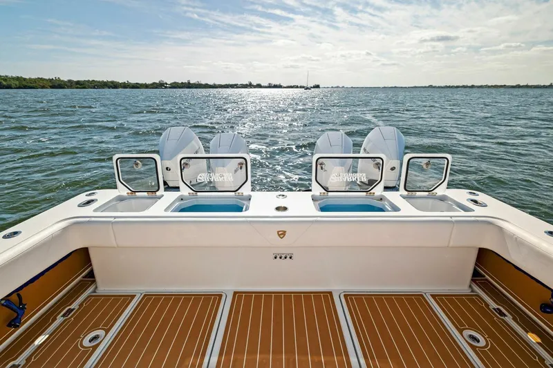Slide: The Image of 2022 Barker Boatworks 40 HPC on water, featuring spacious deck and modern design. - 29