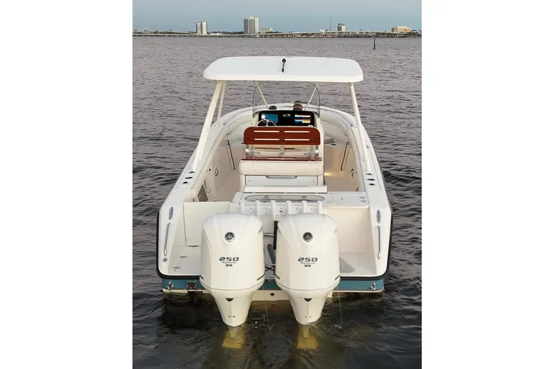 Slide: The Image of 2014 Pursuit S 280 Sport boat with dual 250 HP engines on water. - 28