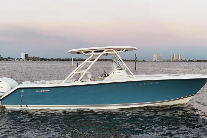 Slide: The Image of 2014 Pursuit S 280 Sport boat on calm water at sunset. - 5