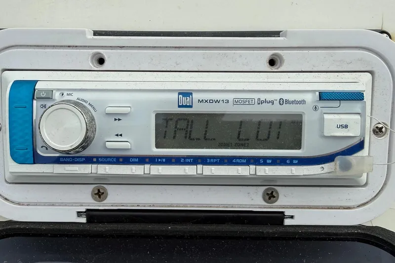 Slide: The Image of 2006 Shoalwater 21 Cat boat stereo system with Bluetooth and USB connectivity. - 10