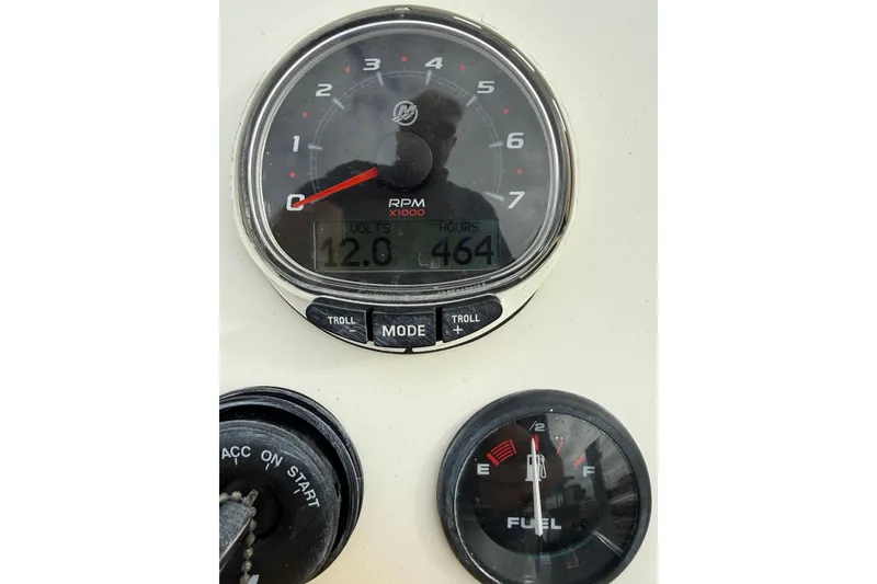 Slide: The Image of Dashboard of 2006 Shoalwater 21 Cat showing RPM and fuel gauges. - 8