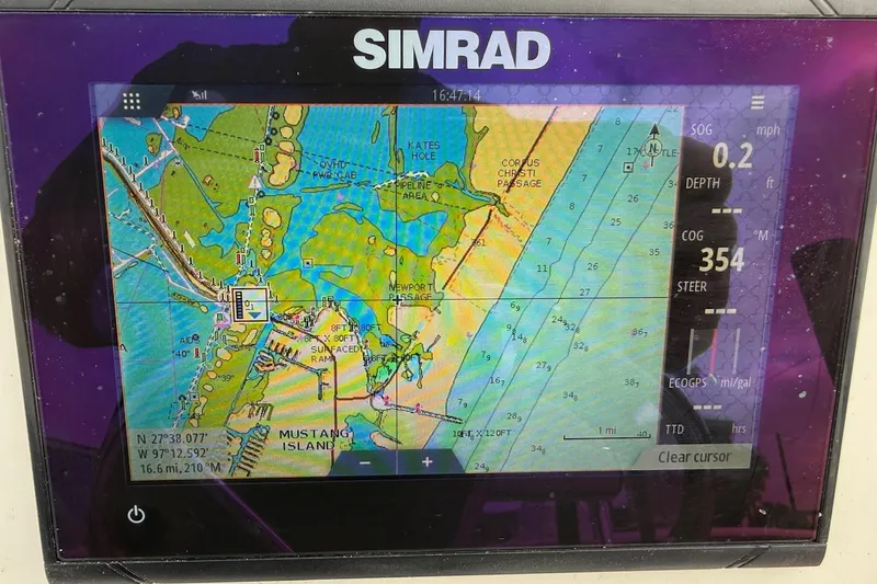 Slide: The Image of Simrad GPS display on 2006 Shoalwater 21 Cat, showing nautical chart and navigation data. - 9
