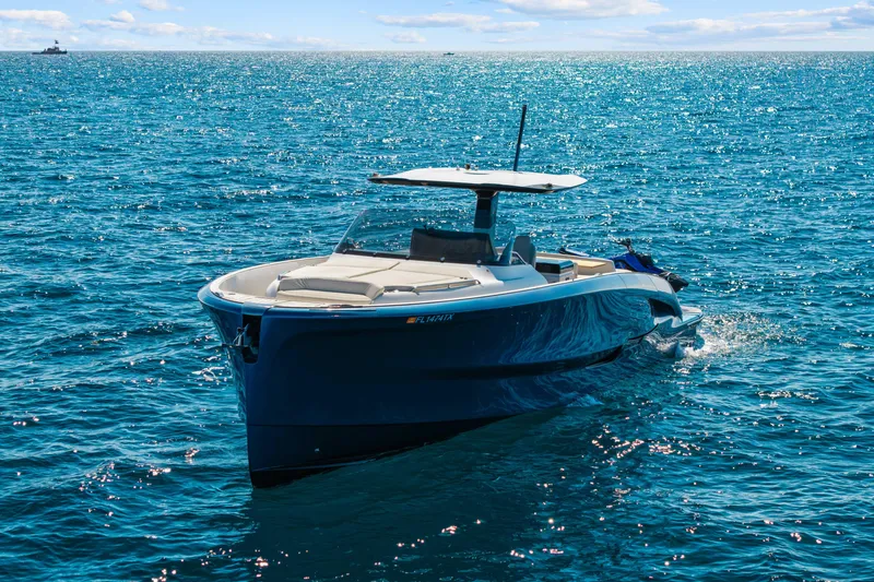 Slide: The Image of 2024 Solaris Power 44 yacht cruising on sparkling blue ocean waters. - 1