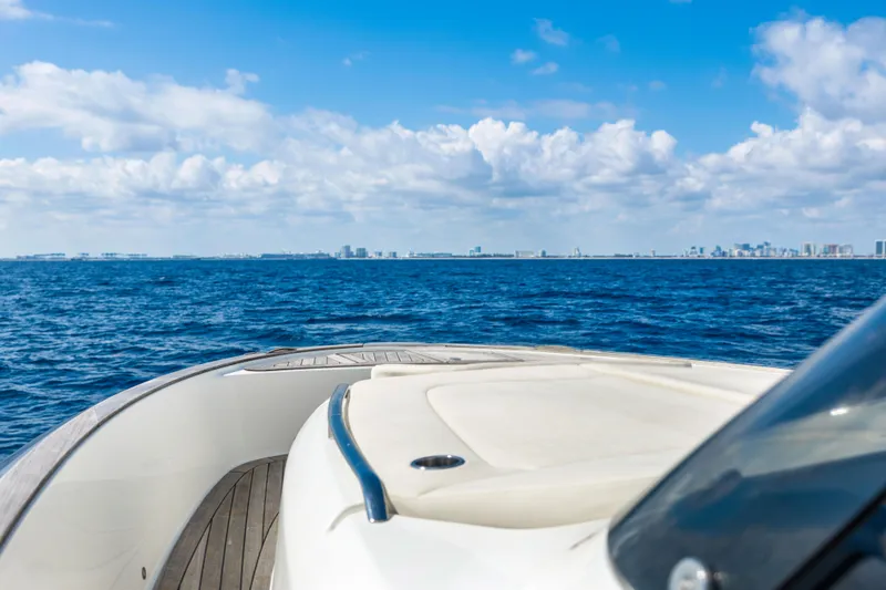 Slide: The Image of 2024 Solaris Power 44 yacht cruising on open sea under blue sky. - 11