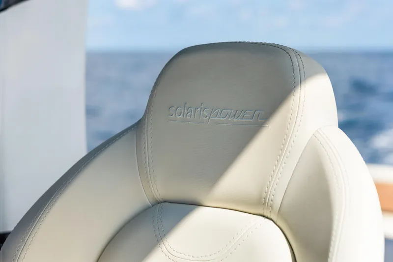 Slide: The Image of Luxurious leather seat on 2024 Solaris Power 44 yacht, ocean in background. - 15