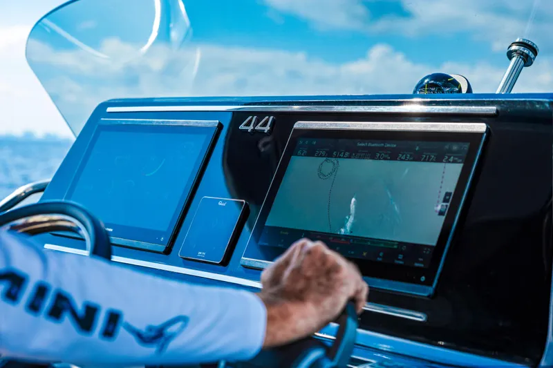 Slide: The Image of 2024 Solaris Power 44 yacht dashboard with navigation screens and steering wheel. - 17