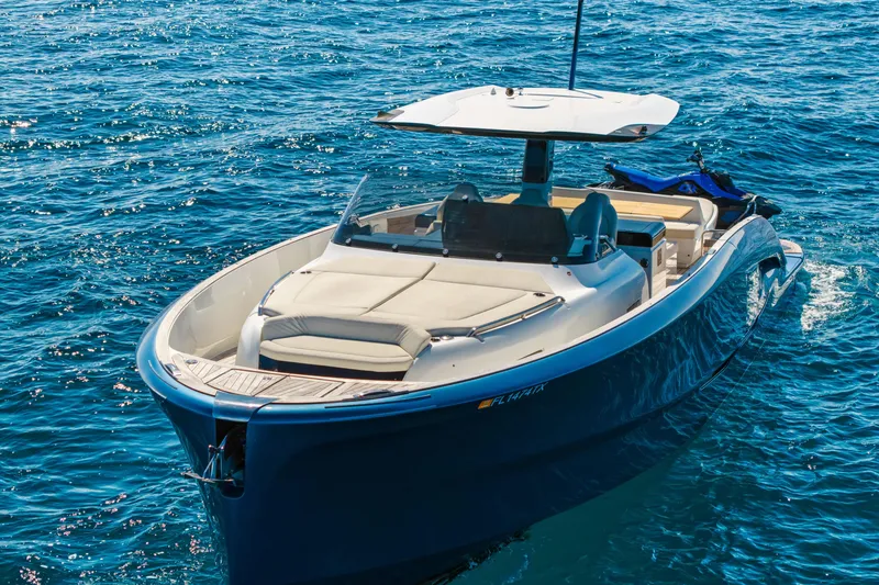 Slide: The Image of 2024 Solaris Power 44 yacht cruising on clear blue ocean waters. - 2