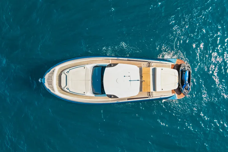 Slide: The Image of Aerial view of 2024 Solaris Power 44 yacht on blue ocean water. - 23