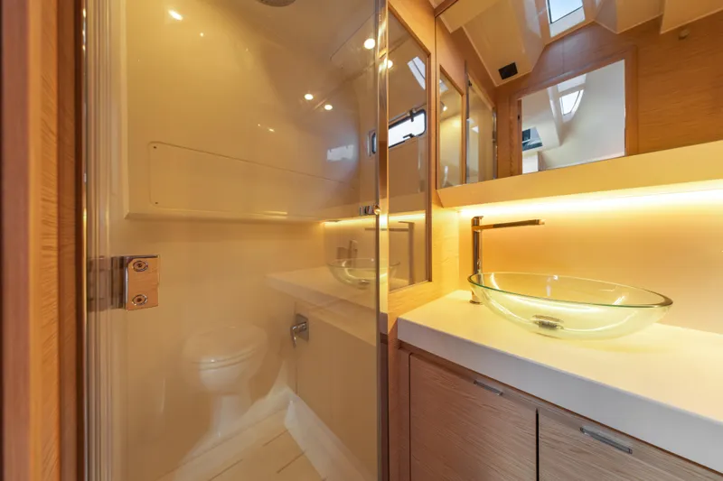 Slide: The Image of Luxurious bathroom interior of 2024 Solaris Power 44 yacht with glass sink and modern fixtures. - 27